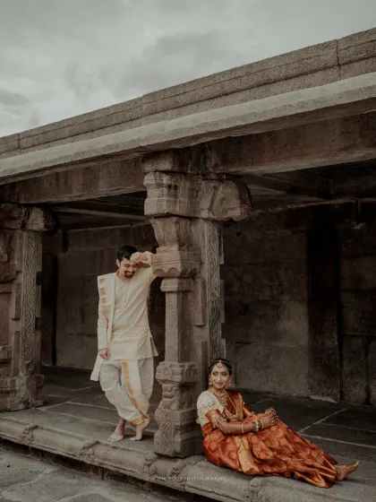 A relaxed and artistic pose within the temple corridor, using the architecture to create a unique and timeless portrait.