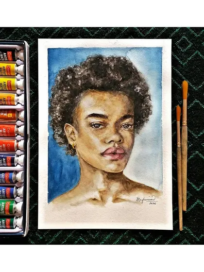 A watercolor portrait study focusing on natural curls and soft, blended skin tones. This piece is laid out next to my paint set, showing the colors used to achieve the final look.