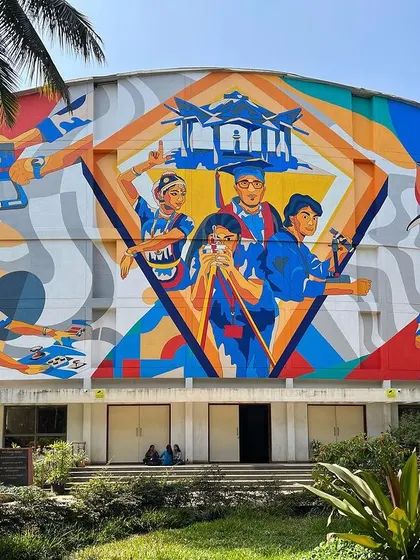 We transformed the massive 50-foot auditorium wall at MVJ College of Engineering into a vibrant story of student life. This colorful mural celebrates the energy and dreams of the campus, creating a landmark that inspires students every day.