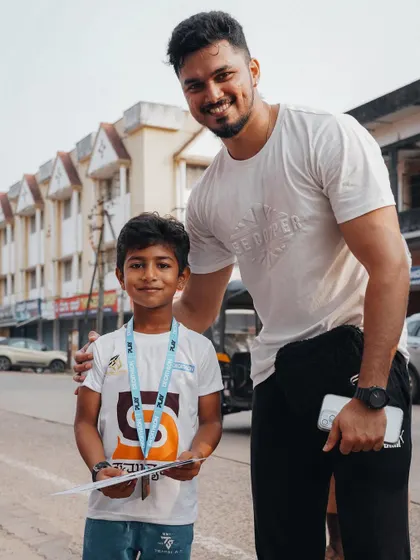 Posing with a young champion after he completed the walk.
