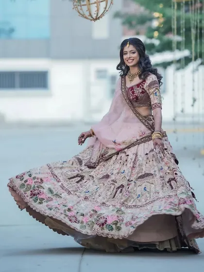 A full-length shot capturing the beautiful movement of her reception lehenga. The entire look, from hair to makeup, is designed to be elegant and photogenic.