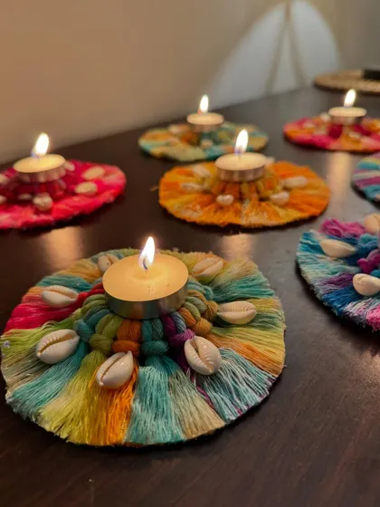 Another angle of the lit macrame candle holders, perfect for any festive celebration.