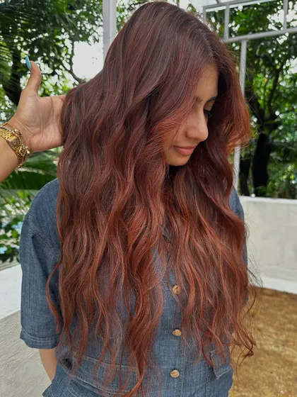 A portrait of the client with her new holiday hair.