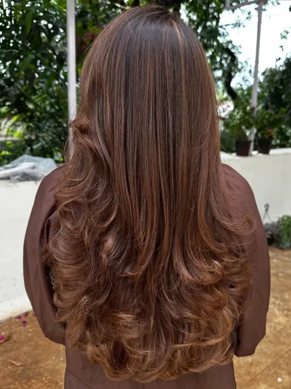 Another 'Vacay Ready' look with soft, cascading waves that show off the fresh layers and highlights.