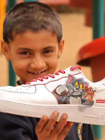 This little guy's happy face makes all the hard work worth it. It was a joy to see his reaction to the finished Tom and Jerry custom sneakers.