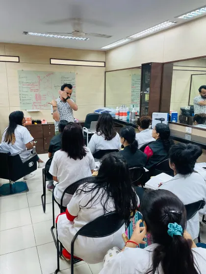 Students observing a live demonstration. This close-up view allows them to see the precise hand movements and techniques used by our professional trainers.