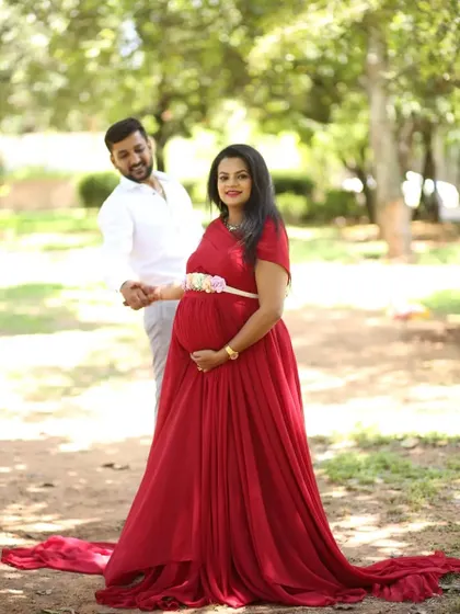 A beautiful couple during their maternity shoot. I gave her a natural makeup look and a floral belt to accentuate her red gown.