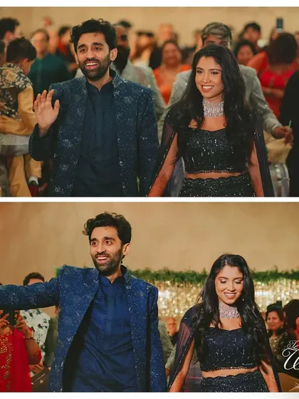 Waving to their guests, the couple looks overjoyed as they enter their Sangeet party.