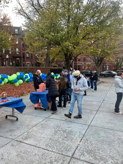 Another view of the event, showing the festive setup with balloons and tables. It was a great opportunity to engage with the local community and share our love for sketching.