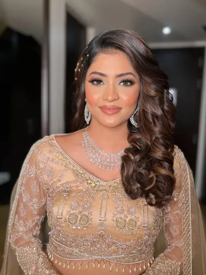 Krisha looks absolutely stunning and ready for a night of dancing. The makeup is designed to be long-lasting and photo-ready.