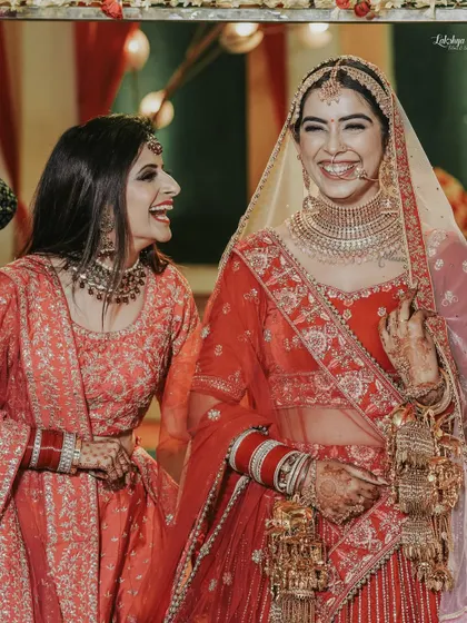 The bride sharing a heartfelt laugh with her sister or best friend. These are the precious, unposed moments that add so much warmth and personality to a wedding album.