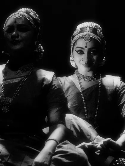 A beautifully captured moment in black and white from 'Tyagaraja Hrt Sadana'. The interplay of light and shadow highlights the subtle expressions of the dancers.
