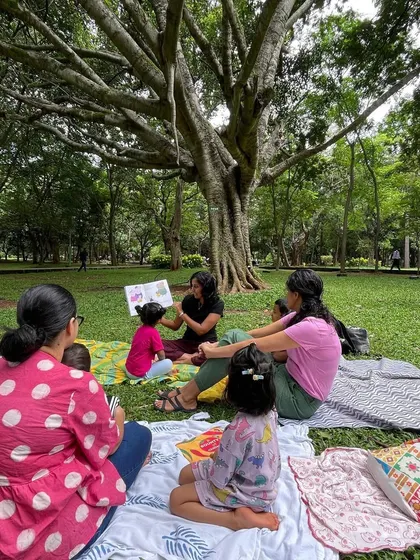 A guest storyteller reads a Peppa Pig book, adding a fun and familiar element to the session. We love when parents from the community join in to share stories.