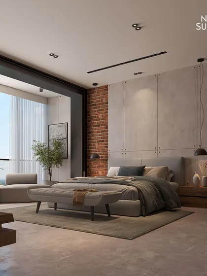 Large windows flood this bedroom with natural light, softening the industrial elements. We designed a comfortable seating nook by the window, creating a perfect spot for morning coffee or quiet contemplation.