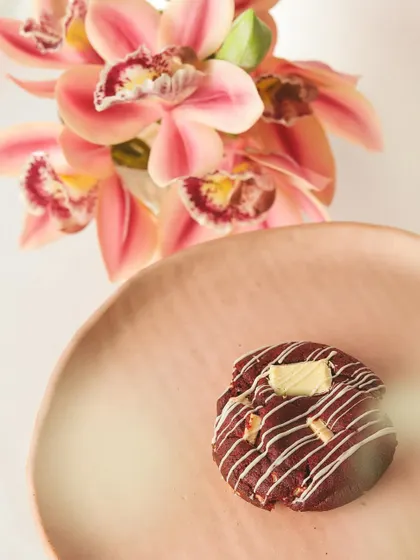 Indulge in the perfect blend of soft red velvet and rich cream cheese filling with our Red Velvet Cookie.