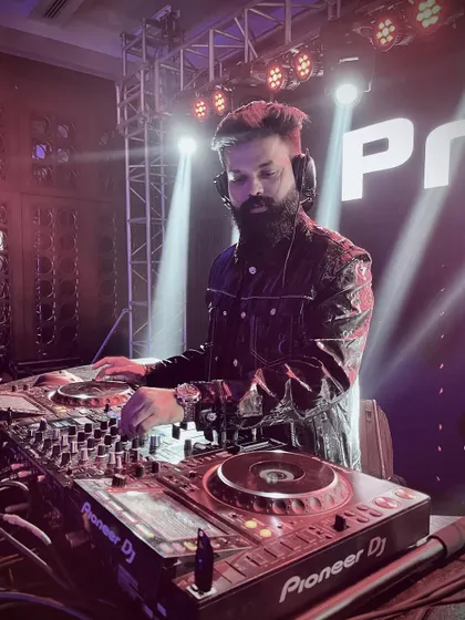 Focused and in the zone. This is me behind the decks, where I feel most at home, mixing tracks and building the energy for the night. A great DJ set is all about reading the room and crafting the perfect musical journey.