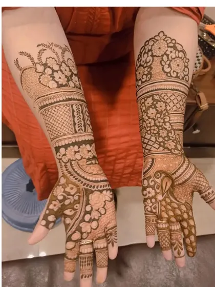 This design shows how different patterns on each hand can create a unique, coordinated look, with one hand featuring a peacock and the other focusing on floral work.