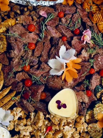 Steak bites sit at the centre of our platter with crackers and accompaniments around them. "It's a steak out."