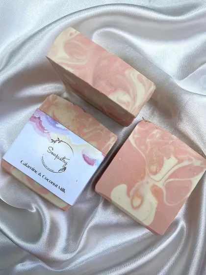 The Calamine & Coconut Milk soap, with its gentle pink and white swirls, is great for soothing sensitive skin.