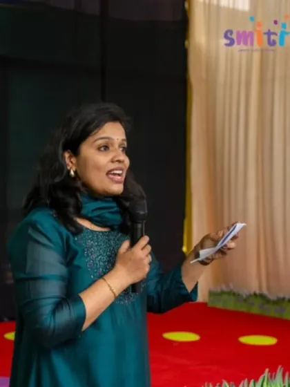 A teacher addresses the audience, her warm expression reflecting the nurturing spirit of our school. Our educators are the heart of our community.