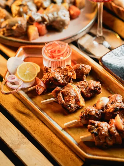These Murg Adani Boti skewers are juicy, smoky, and incredibly satisfying. Each piece of chicken is marinated and grilled, perfect for a live appetizer station at any party.
