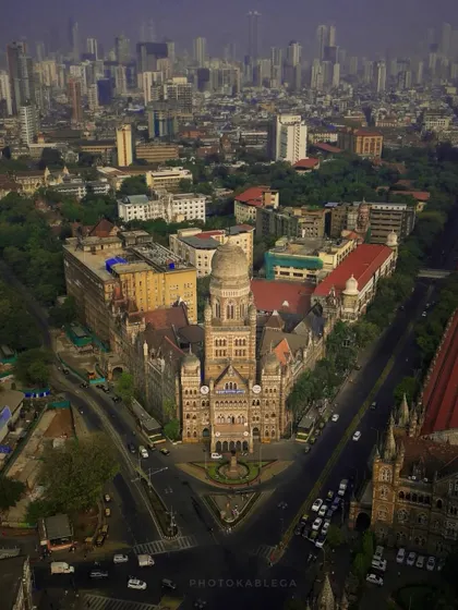 An aerial view of the iconic BMC building in Mumbai. My drone photography highlights the stunning neo-Gothic architecture and its unique placement within the bustling cityscape, a perfect example of Mumbai architectural videography.