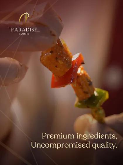 A close-up of a paneer tikka skewer, showcasing the premium ingredients and rich marinade. We believe in uncompromised quality in every single bite.
