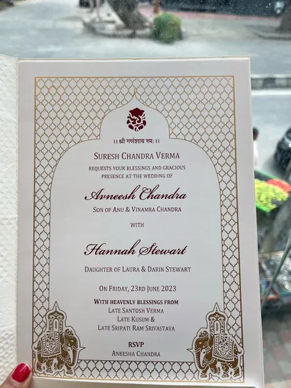 A beautiful example of a traditional Indian wedding invitation for a cross-cultural wedding. The design incorporates classic motifs with English text.