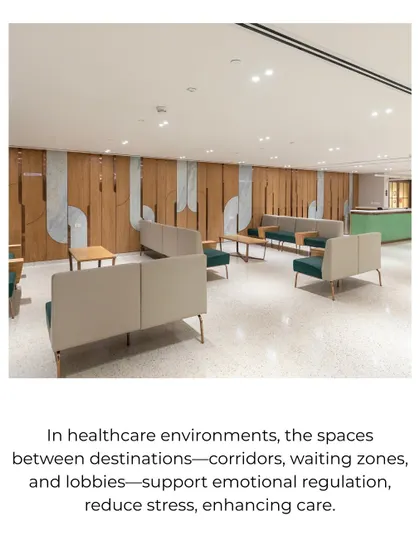 In healthcare environments, waiting zones are opportunities to support emotional regulation. This lounge area uses comfortable, modern furniture and warm wood paneling to create a calm, non-clinical atmosphere.