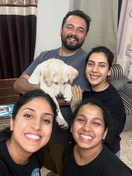 A happy family portrait with their new Labrador puppy after a successful training session. My team and I love being part of a family's journey with their new dog.