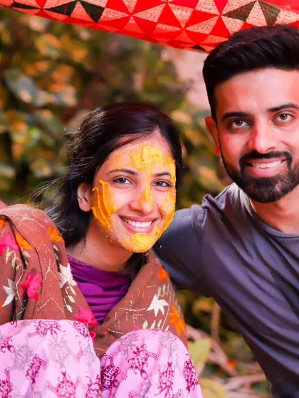 A happy couple portrait from the Haldi ceremony. This is a duplicate image, reinforcing the joy and connection of this special pre-wedding event.
