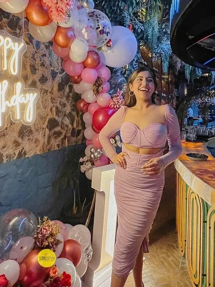 An influencer celebrating her birthday at a trendy bar, with our balloon arrangements adding a festive touch to the venue.