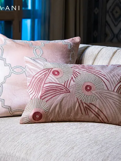 Soothe your senses with soft shades of pink. These two cushions, one with a modern geometric pattern and the other with bold floral embroidery, showcase the artistic variety within my Lotus collection.