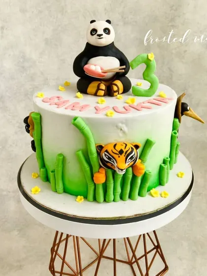 Everybody was kung fu fighting! This cake brings the world of Kung Fu Panda to life with Po on top and the Furious Five peeking through bamboo stalks around the sides. All characters are completely handmade.