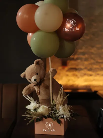 A detailed shot of the teddy bear and balloon centerpiece.
