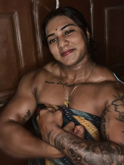 The 'Cutest Beast' in action. This pose emphasizes my bicep and forearm development, showing the results of consistent training under my coach.