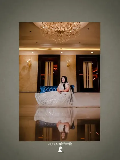 A breathtaking shot of bride Harleen, her reflection perfectly captured on the glossy floor of the venue.