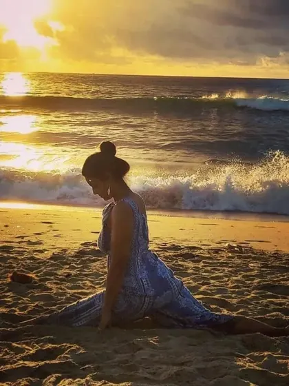 A beautiful sunset on the beach. Sometimes the best yoga is simply sitting still, watching nature's art unfold, and allowing yourself to be present in the moment.