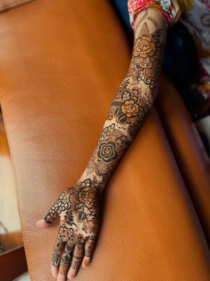 This shot captures the full length of the arm, showing how the floral motifs are balanced and distributed for a harmonious design.