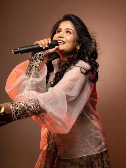 A dynamic shot of the singer, with makeup designed to catch the light and look great in motion.