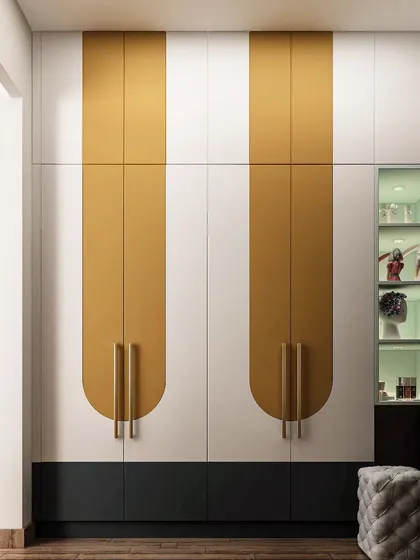 This wardrobe design adds a bold pop of color with its mustard yellow doors. The adjacent glass display cabinet is perfect for showcasing trophies or favorite collectibles, making the storage unit a personal statement.