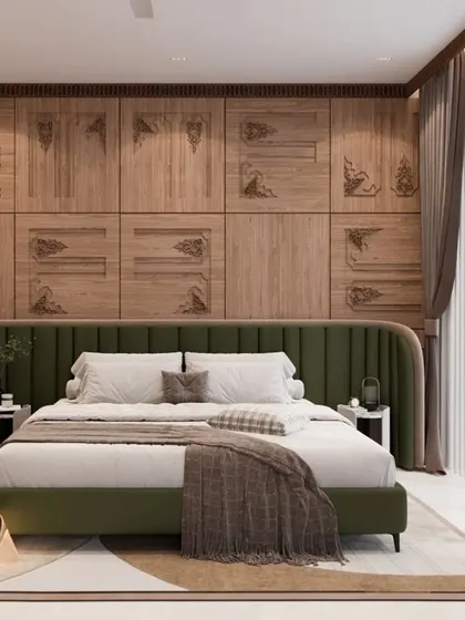 This luxurious bedroom design features intricately carved wooden paneling behind a lush green upholstered bed. The combination of natural textures and modern furniture creates a sanctuary of comfort and style.