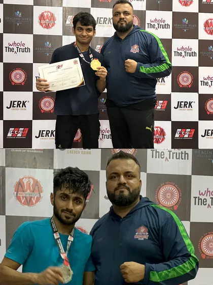 Me with two of our fighters and their medals. Guiding them on this journey and seeing them succeed is my greatest reward as a coach.