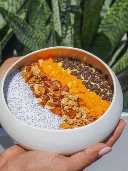 We use natural light and thoughtful composition to create bright and appealing lifestyle food shots. This image of a healthy smoothie bowl captures a feeling of wellness and morning energy.