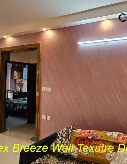 This living room wall is enhanced with an Infinitex Breeze texture in a warm, rosy hue. The diagonal pattern adds a sense of movement and softness, creating a welcoming and stylish feature wall.