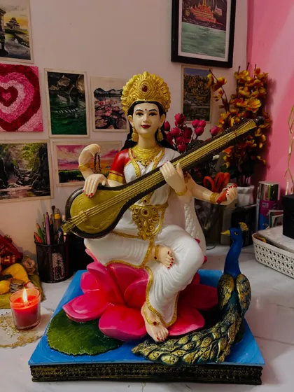 Besides large backdrops, I also do detailed painting work on fiber murtis. This is a Saraswati idol I painted for Dussehra, focusing on bringing the features to life with careful color application and delicate brushstrokes.