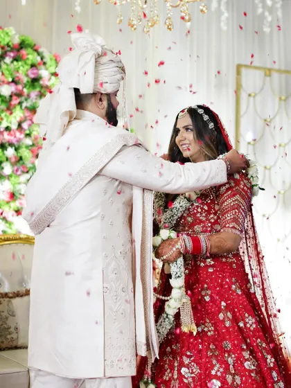 Hero Item. The Jaimala ceremony is a moment of pure joy and union. We captured this beautiful exchange between Akanksha and Dishant as flower petals rained down, freezing this perfect, unscripted celebration of their love story.