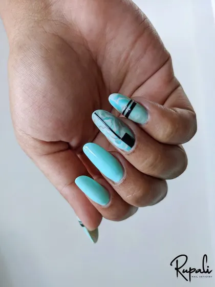 A client's hand with fresh nail extensions and a cool-toned marble art design. The solid turquoise nails balance the look perfectly.