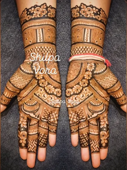 A symmetrical design with modern, abstract patterns and a clean, banded look on the wrist.