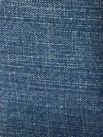 A medium-fade denim with a visible crosshatch weave. This fabric offers a great balance of color and texture for a classic denim look.